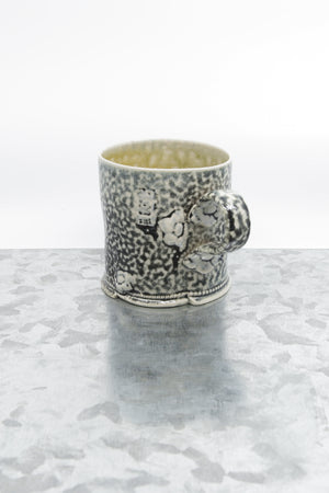 Stoneware mug with flower detail